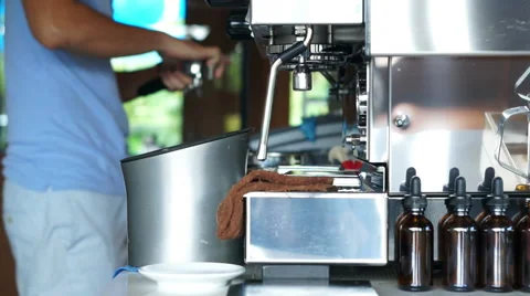 Barista making coffee in background of machine 스톡 동영상 59530781