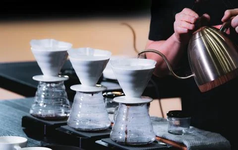 Barista is making coffee, coffee preparing with chemex, Chemex Dripping hot f Stock Photos