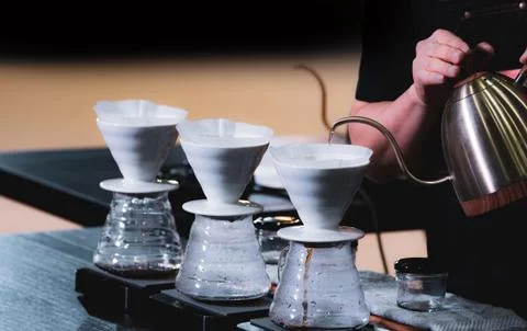 Barista is making coffee, coffee preparing with chemex, Chemex Dripping hot f Stock Photos