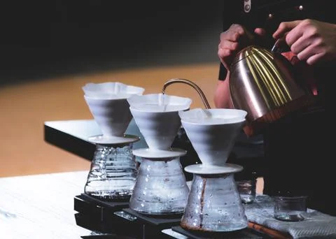 Barista is making coffee, coffee preparing with chemex, Chemex Dripping hot f Stock Photos