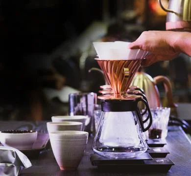 Barista is making coffee, coffee preparing with chemex, Chemex Dripping hot f Stock Photos