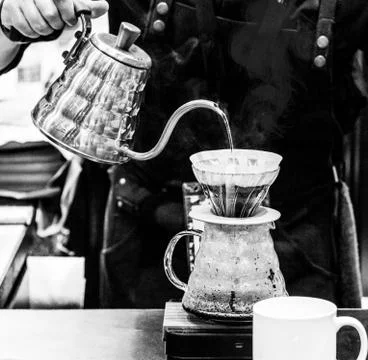 Barista is making coffee, coffee preparing with chemex, Chemex Dripping hot f Stock Photos