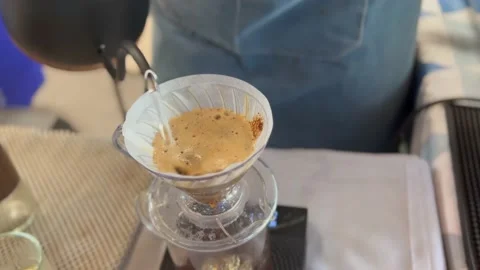 Barista making craft filter drip coffee at cafe indoor. Stock Footage 231953465