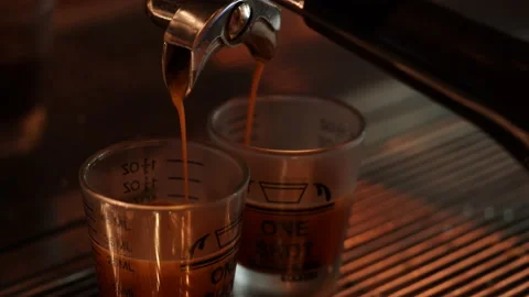 Barista making espresso coffee cup pouring or brewing from coffee machine Stock Footage 185050787