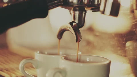 Barista making two espresso in a coffee machine Video stock 157211406