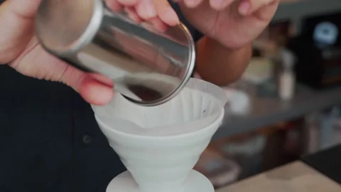 Barista man making craft filter drip coffee at bar in coffee shop. Stock Footage 159401609