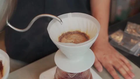Barista man making craft filter drip coffee at bar in coffee shop. Stock Footage 159401650