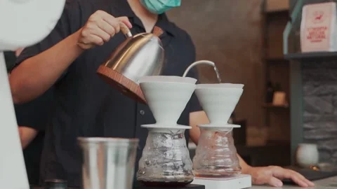 Barista man making craft filter drip coffee at bar in coffee shop. Stock Footage 159401660