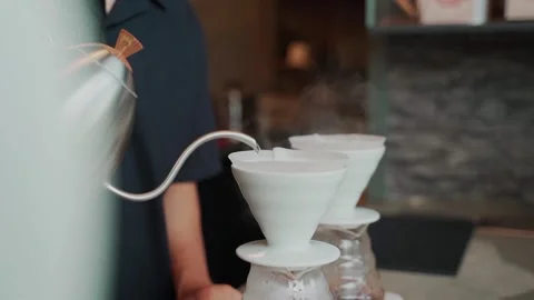 Barista man making craft filter drip coffee at bar in coffee shop. Stock Footage 159401706