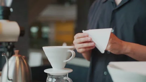 Barista man making craft filter drip coffee at bar in coffee shop. Stock Footage 159401763