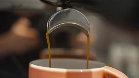 Barista man making double espresso, using filter holder, flowing fresh ground Video stock 285140515