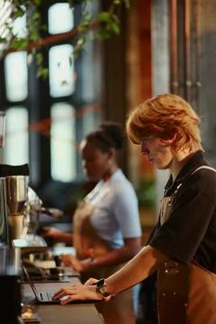 Barista Man Using Laptop While Working in Modern Coffee Shop Stock Photos