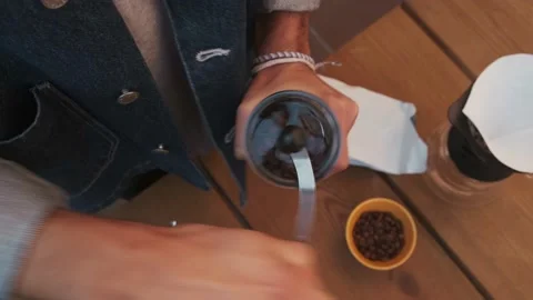 Barista manually grinding coffee beans. Stock Footage 145811292