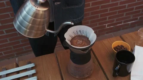 Barista performs second pour of V60 coffee process. Stock Footage 145811360