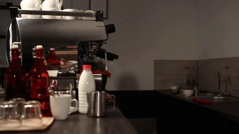 Barista pouring milk into coffee while preparing it in coffee shop Stock Footage 111273331