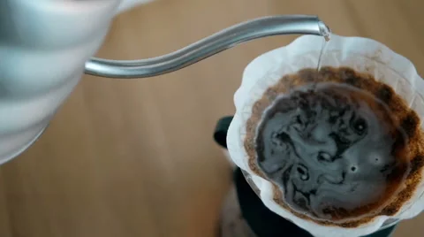 Barista Pouring Water On Coffee Ground With Filter, Hand Drip Coffee Stock Footage