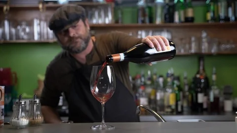 Barista pouring wine Stock Footage 124140670