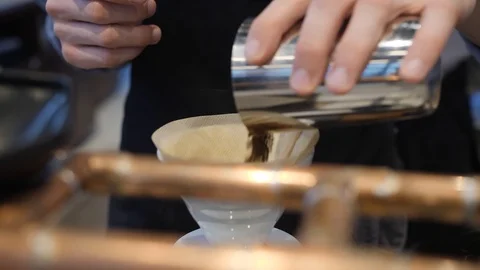 Barista pours ground coffe into filter for making aroma hot beverage Stock Footage 117282997