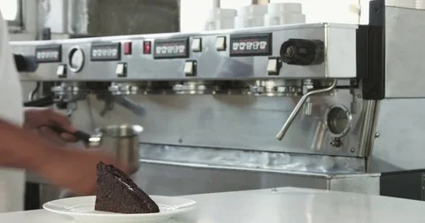 Barista prepare milk with cffee machine in backround Stock Footage 77643983