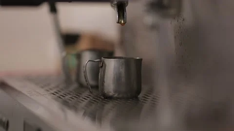 A barista prepares coffee in a coffee machine, close-up video Stock Footage 153047682