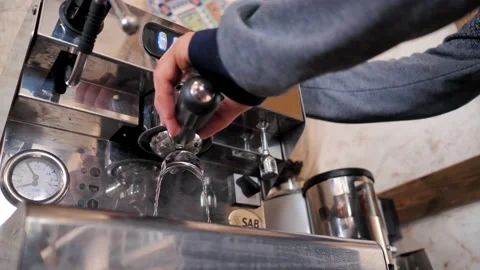 The barista prepares the coffee machine for work. Washing the coffee machine Stock Footage 202008884
