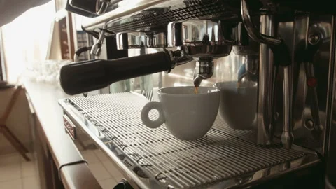 Barista prepares espresso in a coffee machine Stock Footage 100534731