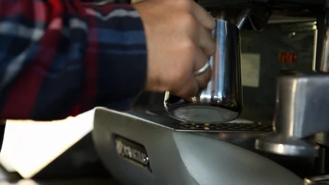 Barista preparing coffee in coffee machine Stock Footage 90539372