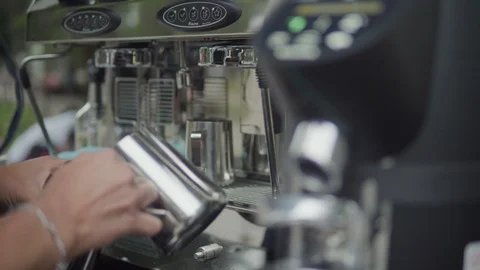 Barista is preparing coffee. Steaming and frothing milk for cappuccino or latte. Stock-Footage 116333467