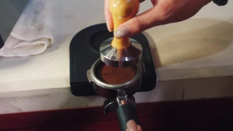 Barista Preparing Espresso Shot by Pressing Ground Coffee Beans Stock Footage 346665916