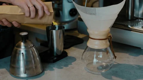 Barista preparing Filter coffee with fresh coffee beans. Trendy drink Stock Footage 145467072