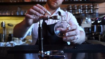 Barista preparing to make Syphon alternative coffee brewing style Video stock 85617392