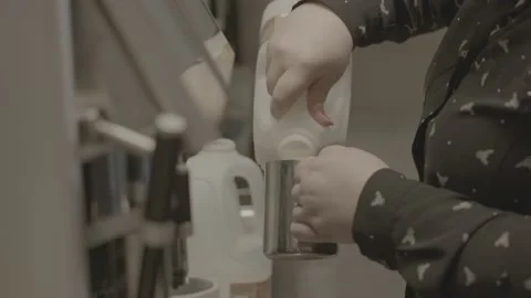 Barista preparing milk and coffee with professional equipment, coffee machine Stock Footage 198342012