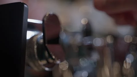 Barista presses coffee machine button repeatedly with precision Stock Footage 297352134