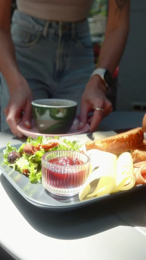 Barista Serving Fresh Coffee at Table with Breakfast in Cafe Stock Footage 339085786