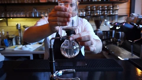Barista setting up Syphon coffee maker Video stock 85616172