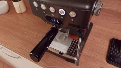 Barista Starts Extraction And Timer On Espresso Machine With Glass Cup On Scale Stock Footage 328854589