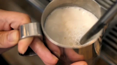 Barista Steaming Milk For Hot Cappuccino Coffee With Machine Stock Footage