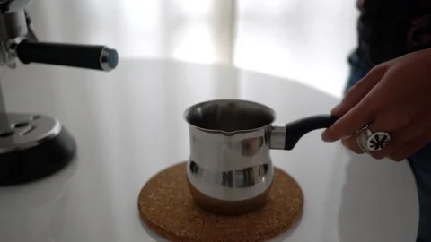Barista steaming milk for a latte or cappuccino Stock Footage 101463523
