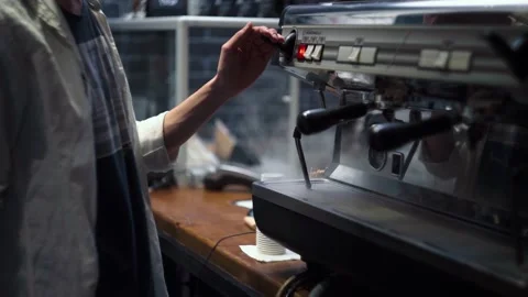 The barista wipes the coffee machine. Video stock 165001994