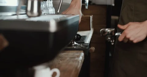 Barista at work in the cafe, close-up. Coffee making process in professional Stock Footage 88741825