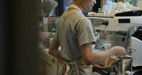Barista at work. The process of making coffee. Preparing cups of espresso at a Video stock 92232192