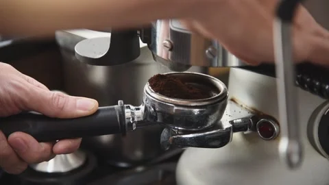 Barista worker man using grinder machine to grind fresh coffee beans Stock Footage 135446914