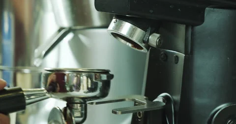 Barista worker man using grinder machine to grind fresh coffee beans Stock Footage 136328932