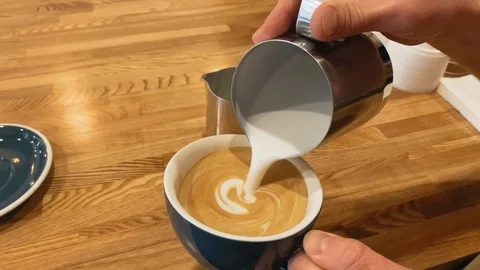 Barista working. The process of making coffee. Barista making of cafe latte art Stock Footage 123553051