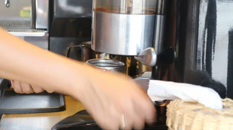 BaristaMakingGroundCoffeeWithCoffeeGrinder HD Stock Footage 39678095