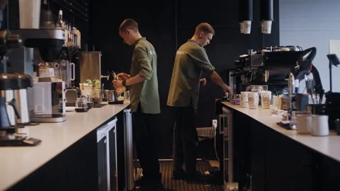 Baristas Making Coffee Side by Side in Modern Cafeteria 스톡 동영상 307590176