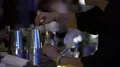 Barkeeper hands visitor big alcoholic cocktail with a lot of ice, bar counter 4k or 4k+ Resolution