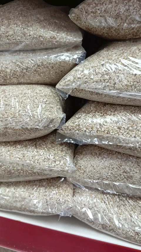 Barley groats in a package on the shelf in the store. Grocery on the counter in Stock Footage 336182798
