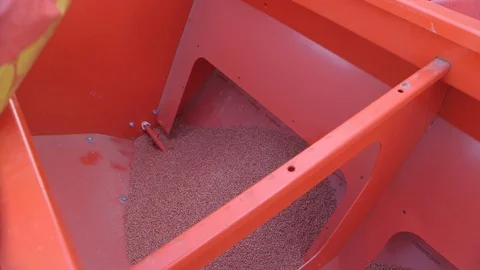 Barley seeds being loaded in a seeding machine Stock Footage 113289930
