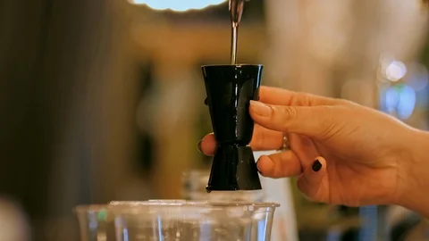 Barmaid Hands Pouring Alcohol to Cocktail Drinks in Bar or Night Club Party Stock Footage